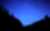 The Andromeda Galaxy hovering above the horizon (the faint blur near the bottom center of the image).  At 2.6 million light-years away, it is the most distant celestial object that you can see with the naked eye.